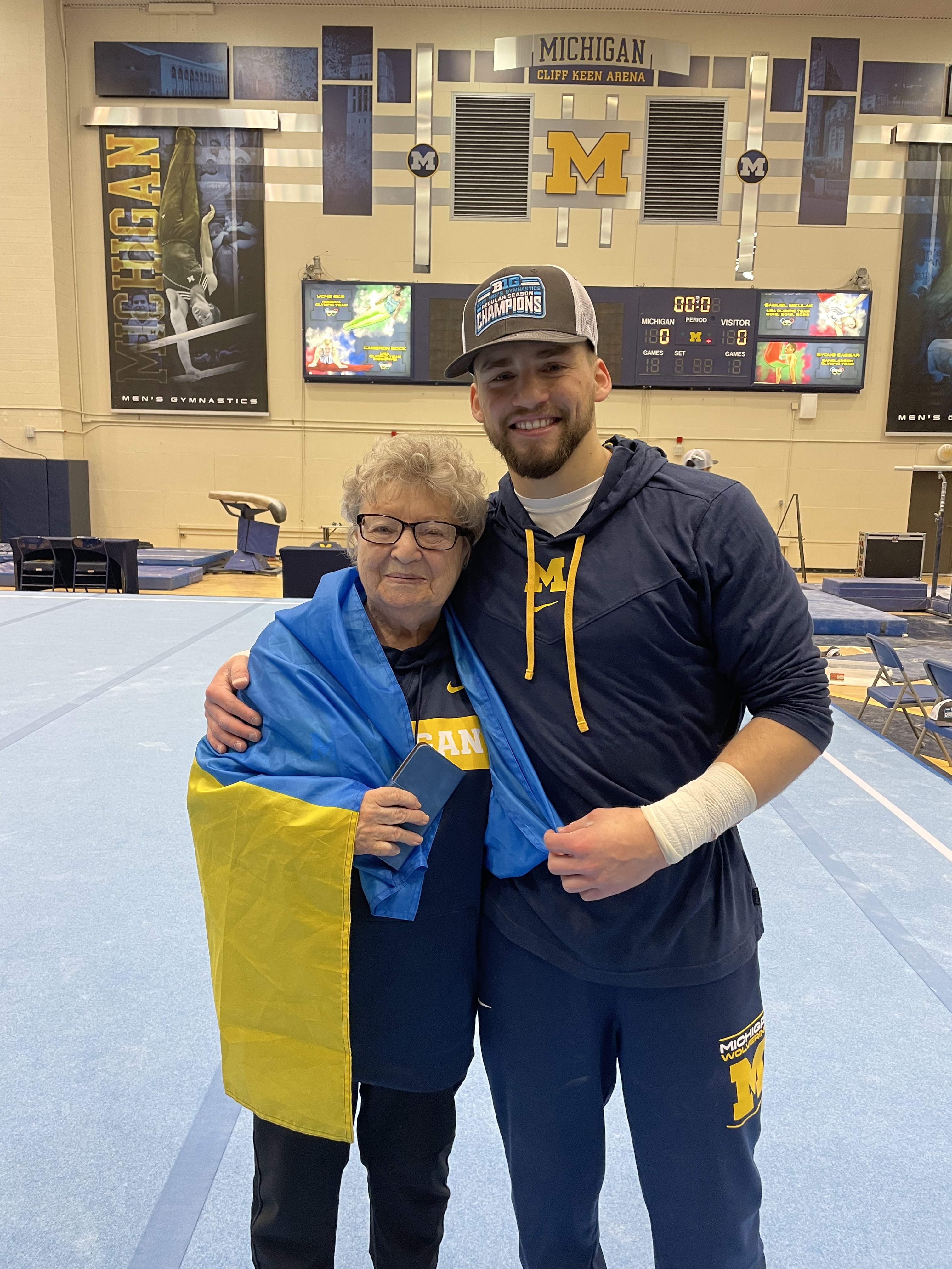 Alan and his grandmother with a Ukrainian flag